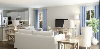 a living room filled with furniture and a flat screen tv